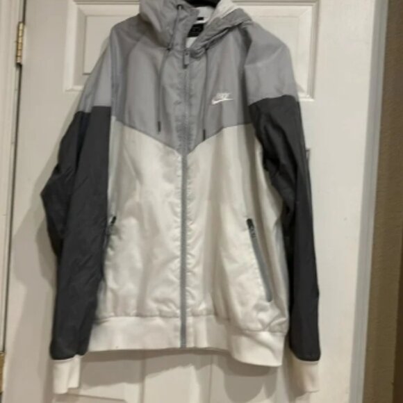 white and silver nike windbreaker